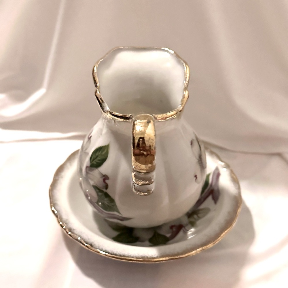 Antique Hand painted Creamer and Saucer. Hand-painted in Japan.